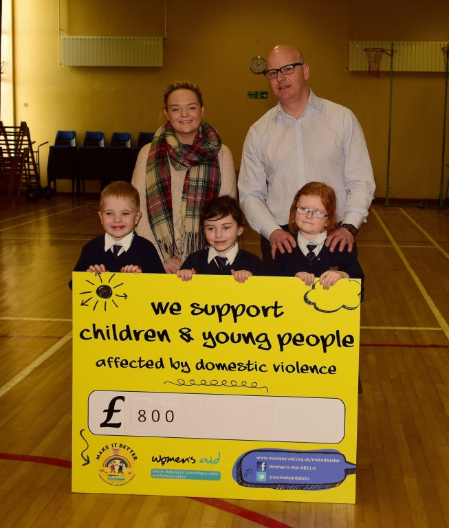 Principal Mr Skinner and pupils presenting Ruth (Fundraising Co) with a cheque of £800