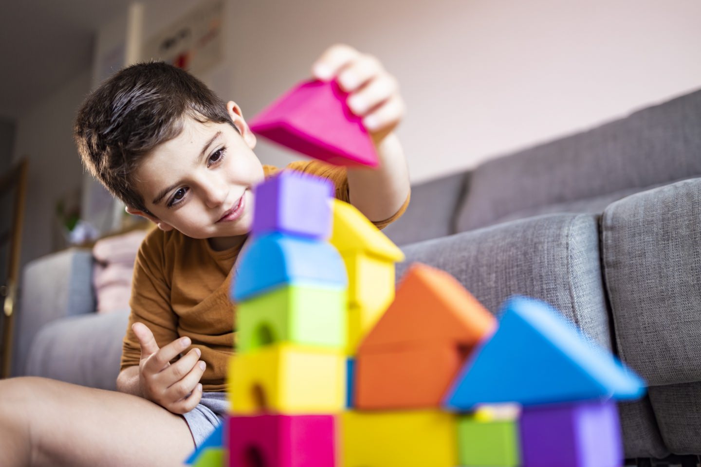 Funny Boy Playing With Blocks At Home