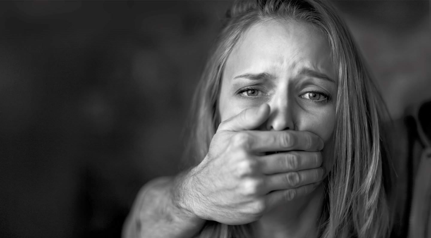 Woman With Mans Hand Covering Her Mouth